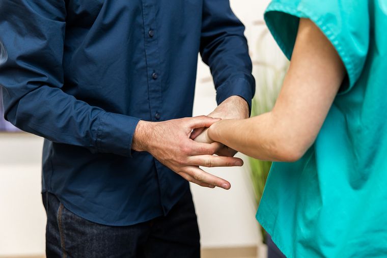 Hands-on care to a patient's wrist